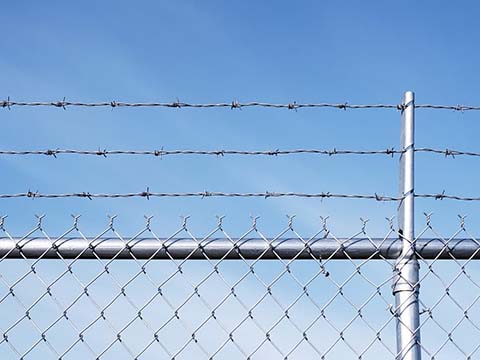 Chain Link Fence With Barbed Wire