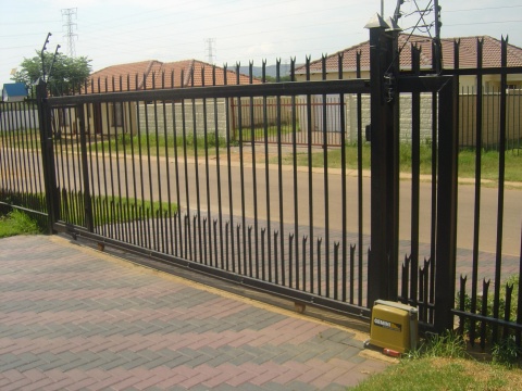 Fence gate with slide