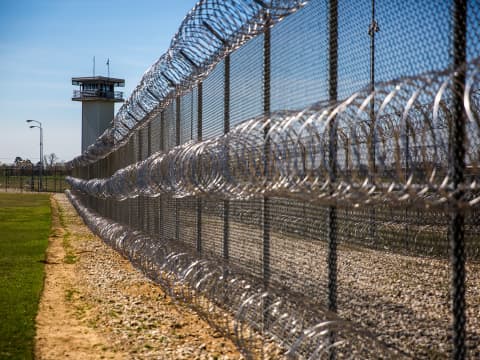 Chain link and barbed wire fencing
