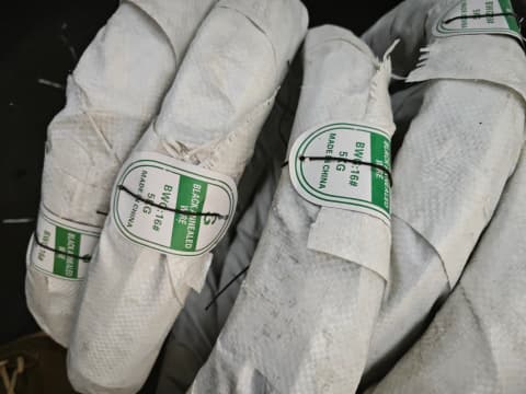 Inner plastic outer woven packaging